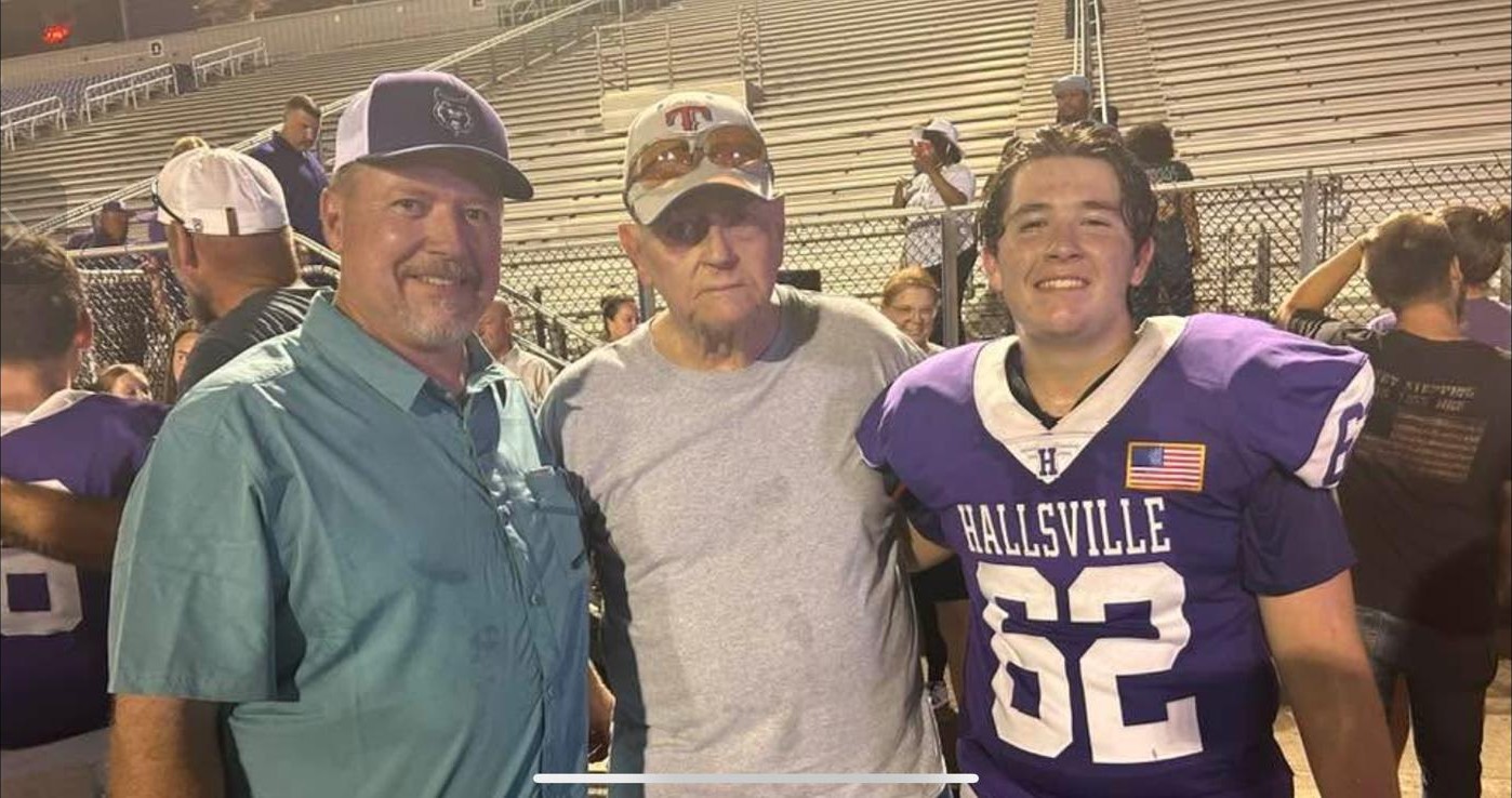 Three generations — Craig, his father Weldon Maitland, and Tyler in his Hallsville football uniform